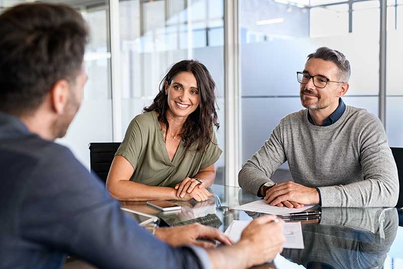 Couple being consulted by a financial planning consultant