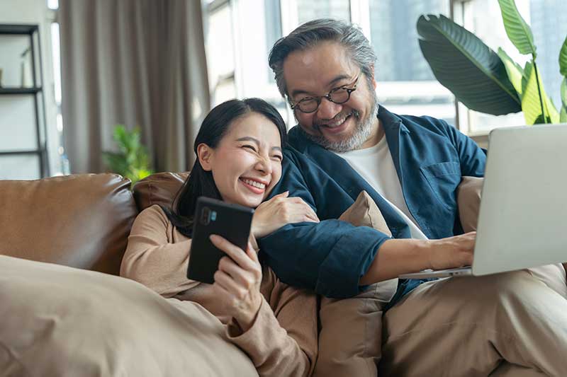 Couple smiling after having their accountant handle their trust and estate taxes