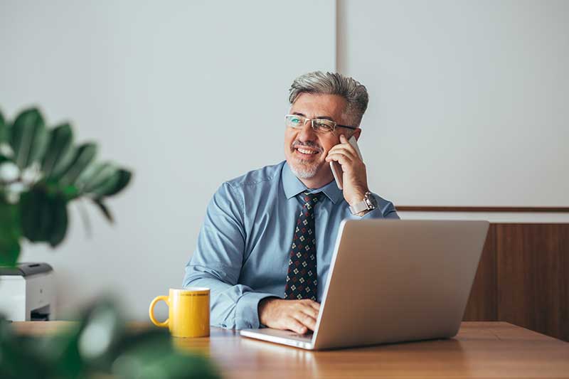 Estate planning consultant on phone with client