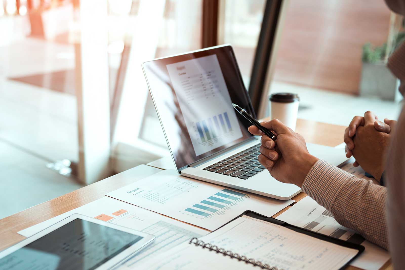 Executive reviewing reports he received from his bookkeeping services