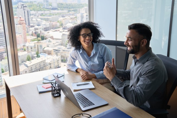 Man training new asset management employee