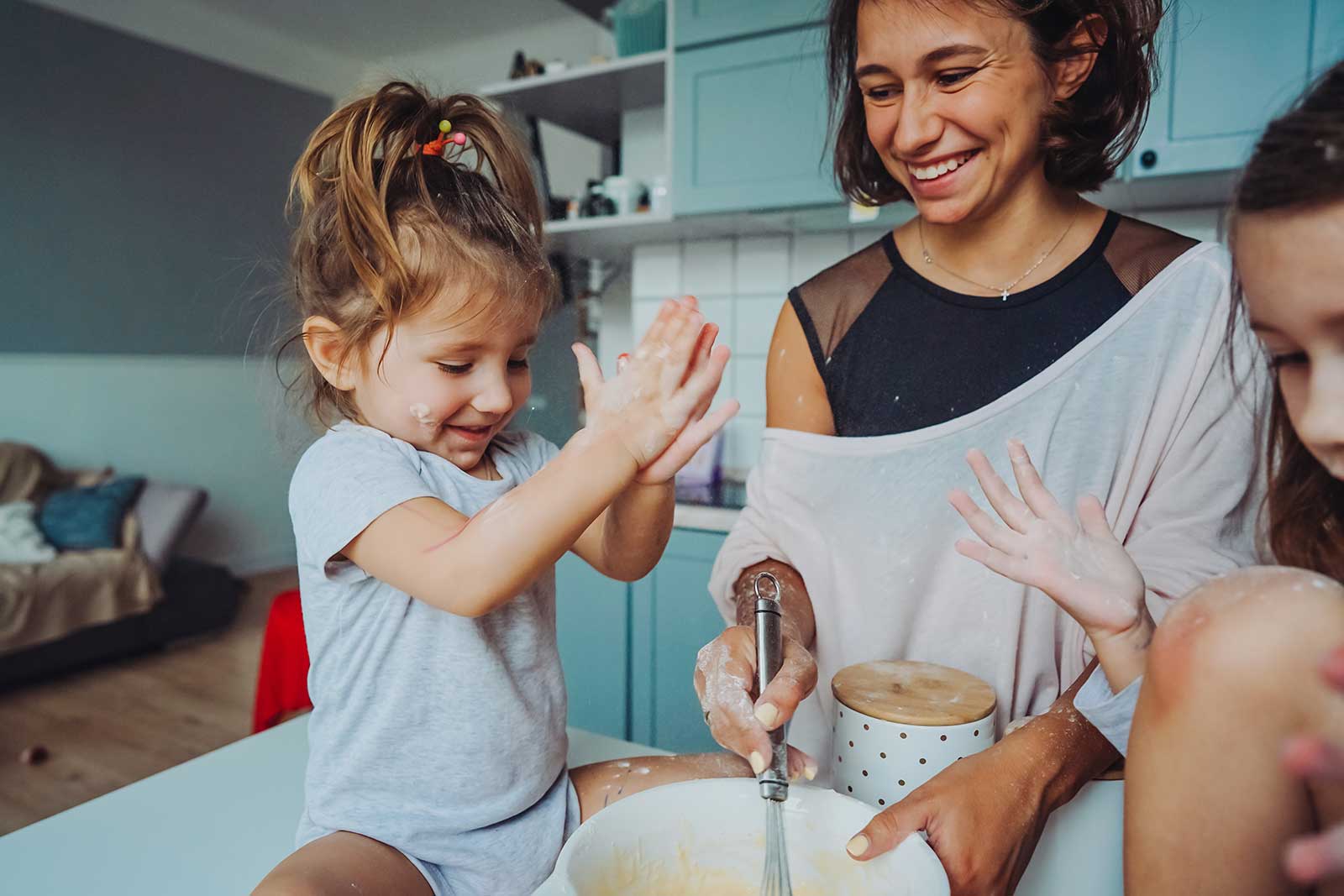 Mother spending time with her children in the kitchen