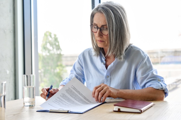 Employer reading a tax planning guide