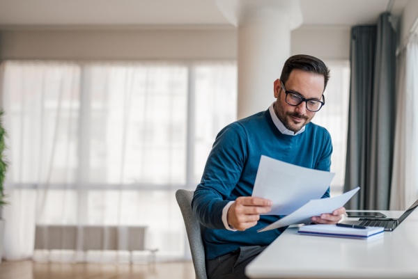 Man reading a tax planning guide