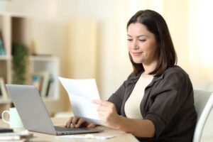 woman reading through employee benefits options