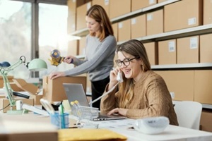 two female employees working in an office